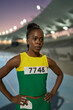 © Trevor Adeline/Caia Image - Portrait tough female track and field athlete at competition