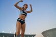 © Trevor Adeline/Caia Image - Excited track and field athlete celebrating victory