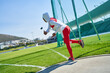 © Trevor Adeline/Caia Image - Female track and field athlete in hijab throwing discus
