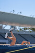 © Trevor Adeline/Caia Image - Female track and field athlete falling over high jump pole