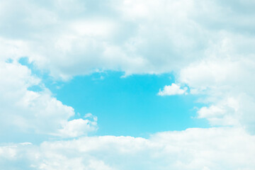 Wall Mural - soft fluffy white clouds floating over light blue sky on sunny day cumulus background scenic. abstra