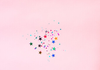 Sticker - Pink background with multicolored glitter and stars. Party background with confetti.