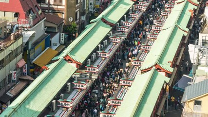 Wall Mural - Time-lapse of people walking and shopping on Nakamise-dori shopping street in Senso-ji temple, Asakusa Tokyo. Japan travel tourism landmark, Japanese city life, or traveler lifestyle concept