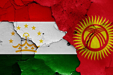 Wall Mural - flags of Tajikistan and Kyrgyzstan painted on cracked wall