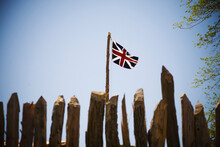 The British Flag Flying Over James Fort In Historic Jamestown, Virginia, USA