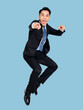 © Tom Wang - Excited young  businessman jumping in air