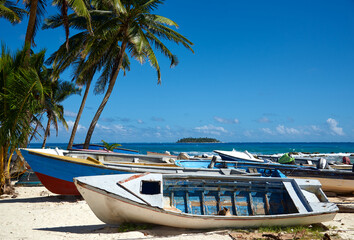 Wall Mural - Fishing boat on the beach on a sunny day in San Andres. Colombia.