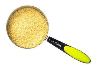 Wall Mural - couscous grains in measuring cup cutout on white