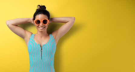 Wall Mural - Flat lay top view portrait of young woman with sunglasses, summer holiday and travel concept.