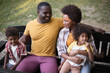 © liderina - One happy family.  Portrait of happy African American family outdoors.