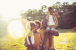 © liderina - Portrait of African American family in nature.