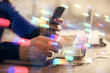 © peshkova - Multi exposure of man's hands holding and using a digital device and data theme drawing. Innovation concept.