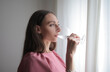 © olly - woman drinks a glass of water