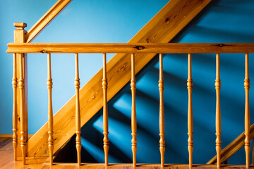 wooden stairs with blue wall