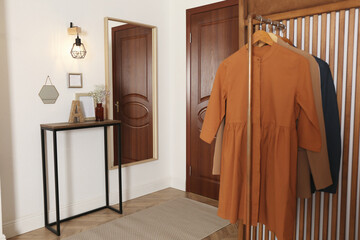 Sticker - Modern hallway interior with stylish furniture and clothes rack