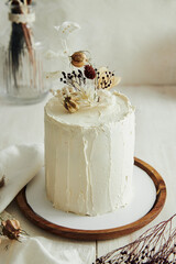 Sticker - Top view of delicious Boho ombre cake with dry flowers on a white table