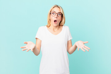 Wall Mural - young blonde woman feeling extremely shocked and surprised