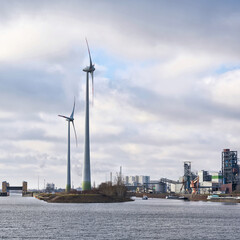 Industrial port of the city of Magdeburg with wind turbines on the Steinkopfinsel on the river Elbe