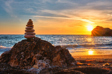 Wall Mural - Concept of balance and harmony - stone stack on the beach