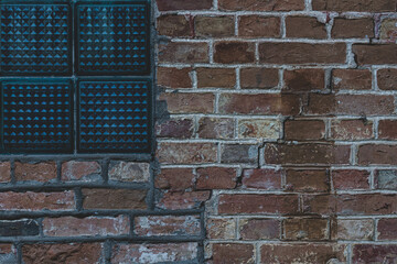 Wall Mural - Window with glass blocks. Glass blocks in a window on a brick wall