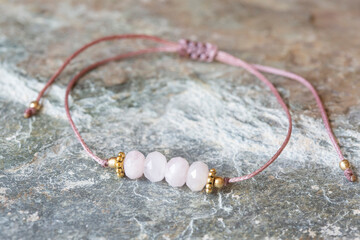 Wall Mural - Morganite cubic cut mineral stone bead bracelet on natural background