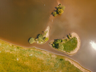 Aerial drone view of two small islands at the lake in the Netherlands