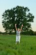 © aletia2011 - Mature woman jumping  on fresh air in summer