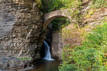 Sentry Bridge Entry Way To Watkins Glen State Park With Falls Below The Stone Arch With Cliff Walls