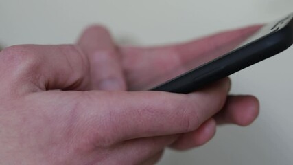 A 4k rendering of a man texting a message with a black smartphone