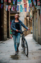 Young Woman With Bike At El Borne In Barcelona