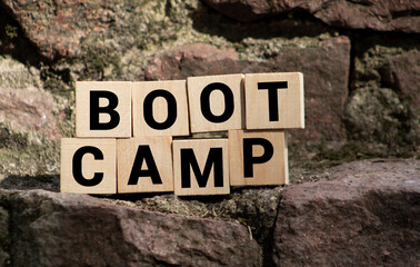 BOOTCAMP word written on wood block, concept