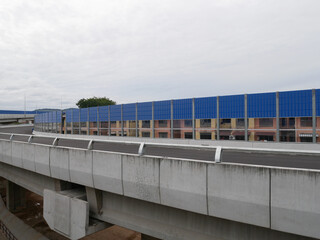 Wall Mural - SELANGOR, MALAYSIA - JULY 5, 2020: Noise barriers are installed along the vehicle lane bordering the residence to prevent noise pollution to the surrounding locals.
