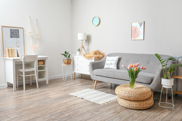 Bouquet of beautiful tulip flowers in interior of living room