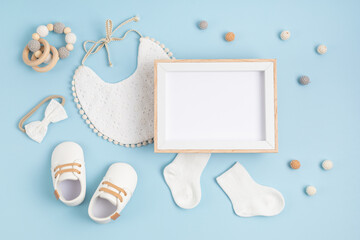 Mockup of empty frame with white baby accessories, baby shower, baptism invitation