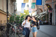 © liderina - Two tourist women on street.  Funny time in new city.