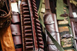 Bandolier made of genuine leather in a shop window. Trade in hunting accessories for storing and carrying cartridges. Close-up