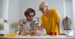 © TommyStockProject - Diverse male and female fashion designers at work discussing and looking at sketches