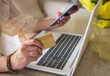 © Nanci - Unrecognizable Woman Making A Purchase On The Internet. Close-up Of The Hands Of A Woman With A Card Making An Online Payment. Online Shopping Concept.