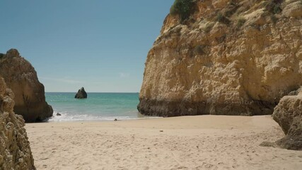 Canvas Print - Moving forward, stabilized, at sea with waves, beach Prainha, for European tourists, in summer. Portugal Portimao