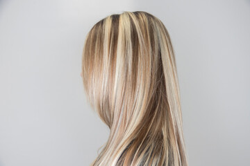 Side view of strait hair with highlights. Soft focus