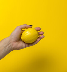 Poster - hand holding a lemon