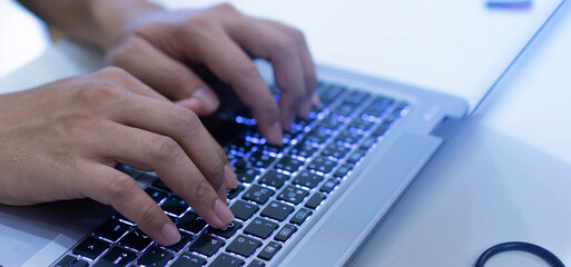 close up specialist programmer hand typing on keyboard on laptop check or command on software for run system at operation data center office for network engineering technology concept