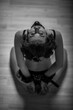 © Михаил Решетников - Slavery in society. The girl is on her knees with a gag in her mouth. Sexual bdsm toy. Woman slavery. Slave attire for playing bdsm games. Frightened slave. Black leather bondage with gag. Scared