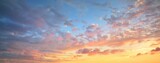 Fototapeta Sypialnia - Clear blue sky. glowing pink and golden cirrus and cumulus clouds after storm, soft sunlight. Dramatic sunset cloudscape. Meteorology, heaven, peace, graphic resources, picturesque panoramic scenery