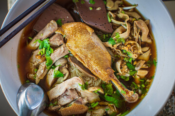 Top view Duck noodle on a white bowl,One of the menu of Thai street street noodles