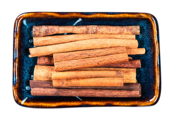 Wall Mural - heap of chinese cinnamon (cassia) in bowl cutout