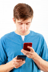 Poster - Young Man with a Two Phones