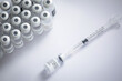 © Jos Temprano/ADDICTIVE STOCK - Close-up of some vials with the coronavirus vaccine along with a needle on a white background