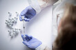 © Jos Temprano/ADDICTIVE STOCK - Anonymous female doctor with vaccine bottle and syringe