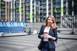 © bisonov - Business woman with a cup of coffee